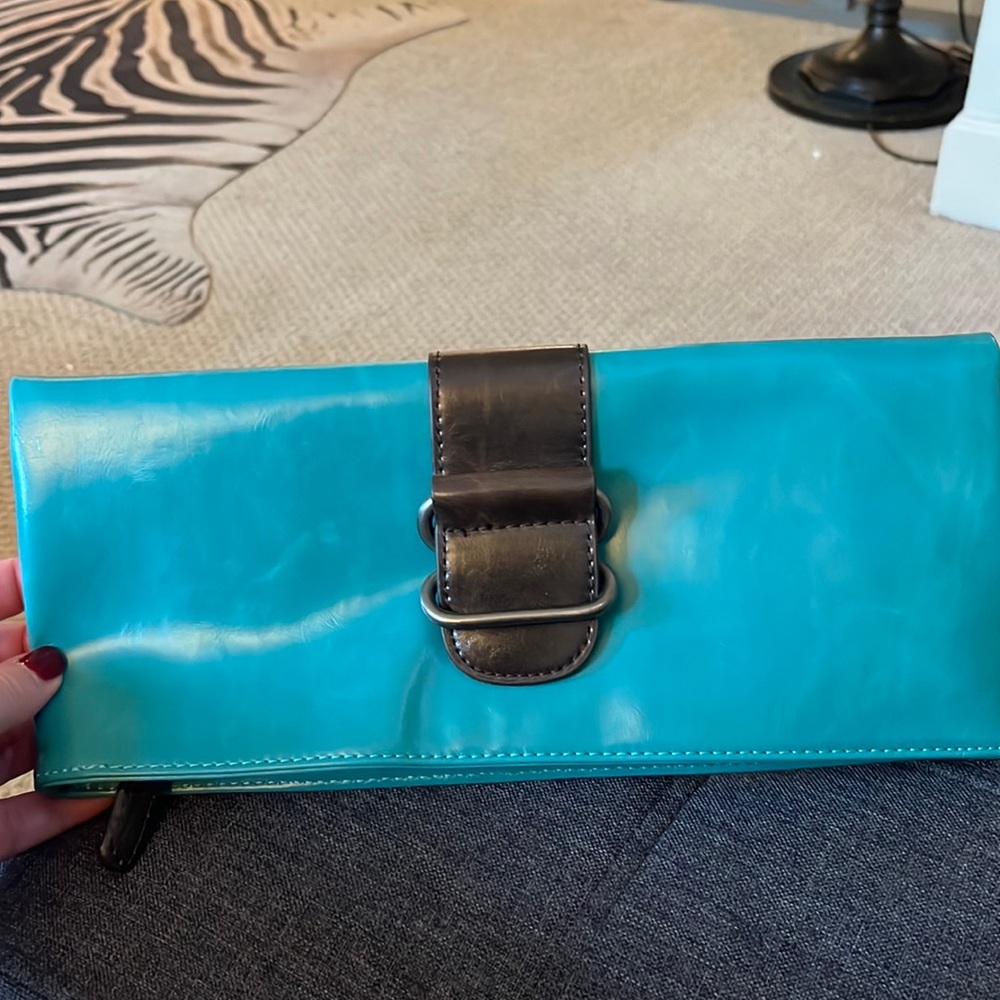 Teal leather clutch.